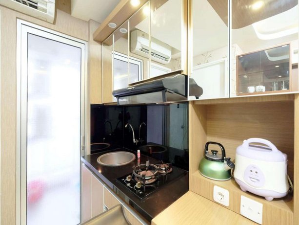 Extravaganza 2BR Bassura City Apartment By Travelio
