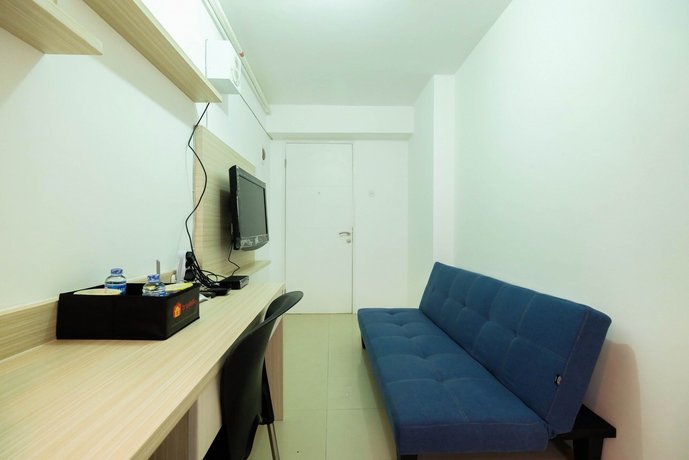 1BR with Sofa Bed at Bassura City Apartment By Travelio