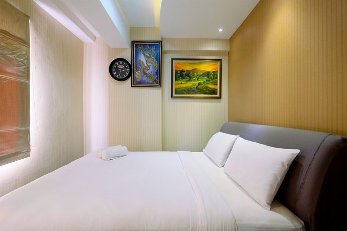 Comfy 2BR Green Bay Pluit Apartment By Travelio